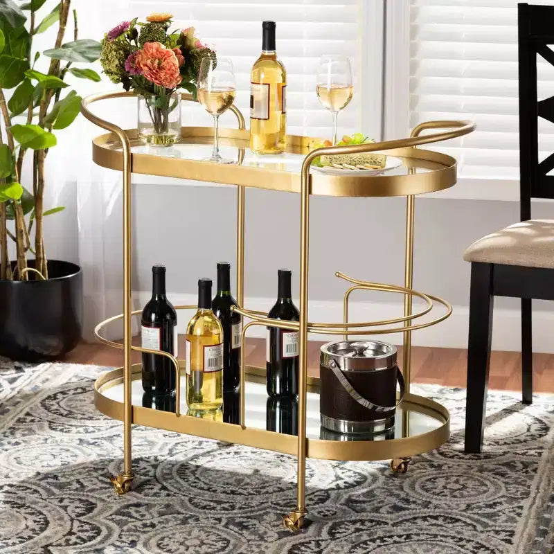 Chariot de bar à vin mobile à 2 niveaux Kamal Glam en métal brossé et verre miroir doré - Baxton Studio : Chariot de service élégant avec roues